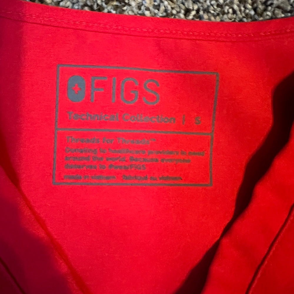 Figs Scrub top size small. Limited edition red. Great condition.